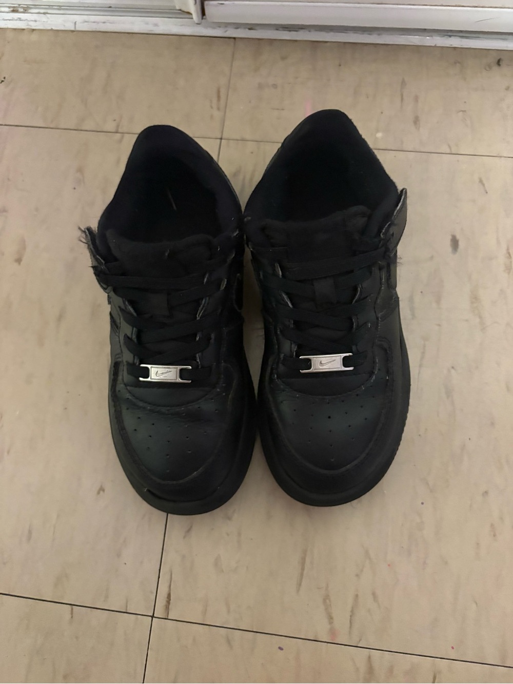 Nike Black Low-Top Kids Sneakers with Silver Lace Tags